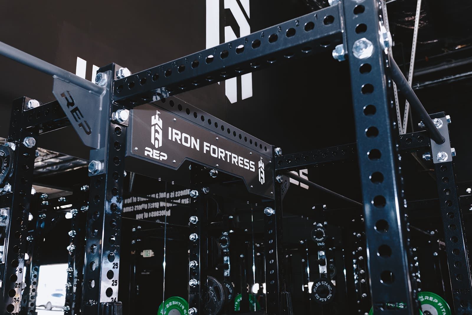 Iron Fortress branded REP power rack on the gym floor, Denver CO