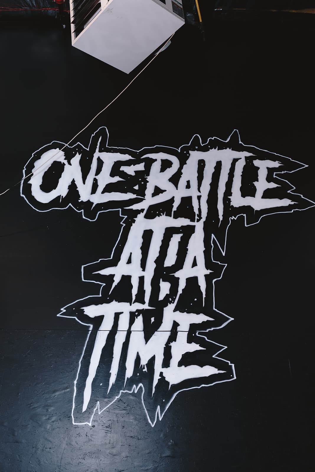 One Battle at a Time wall mural inside Iron Fortress, Denver CO